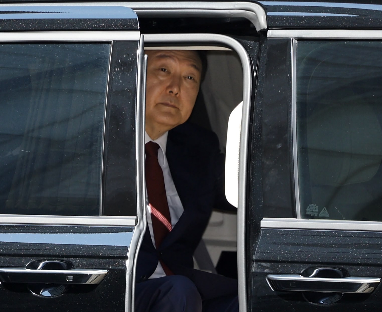 Former President Yoon Suk Yeol appears at the Seoul Central District Court in the capital on Monday to attend the eighth hearing of his trial over insurrection charges in connection with his declaration of martial law.  (Yonhap)
