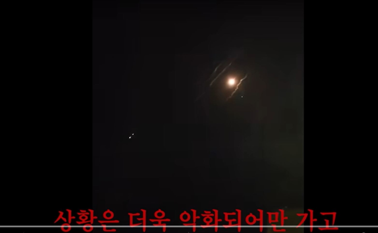 This screen capture of a YouTube video shows a missile flying in the distance, filmed from a college dormitory in Israel during the recent armed conflict between Israel and Iran. (YouTube)