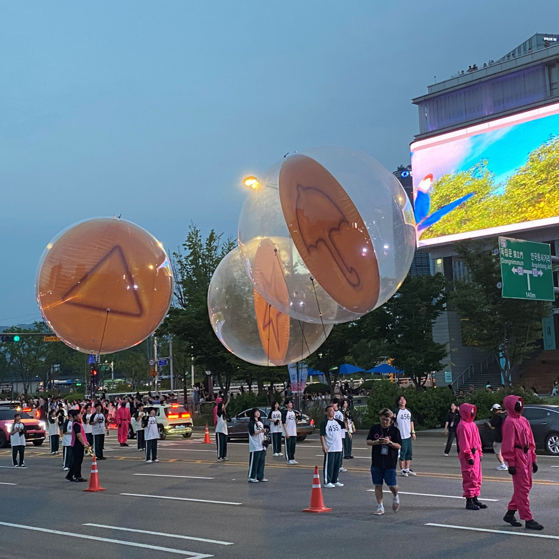 Dalgona figurines are seen floating down the road leading to Seoul City Hall on Saturday. (Lee Yoon-seo/The Korea Herald)