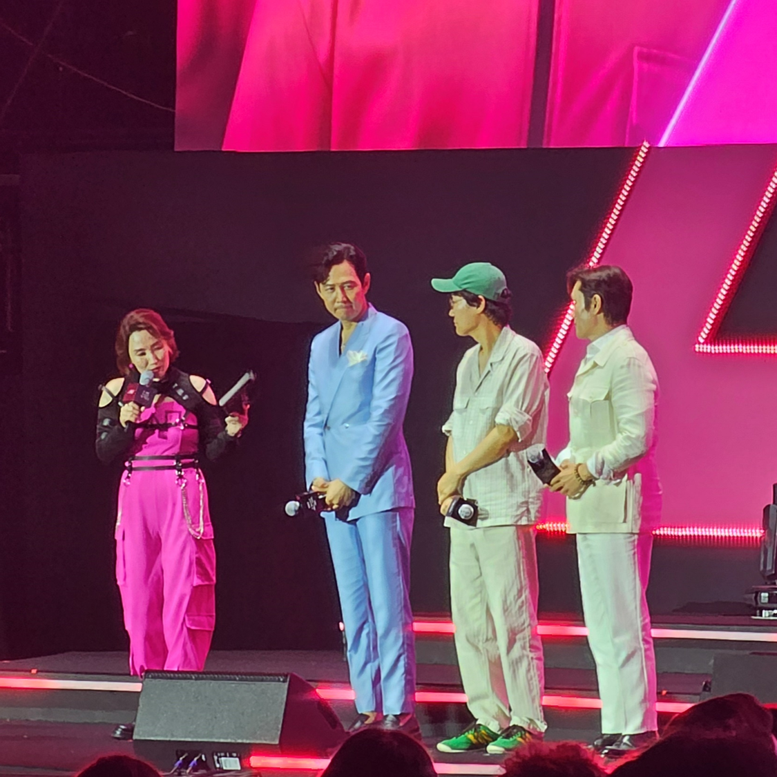 (From second to left) Lee Jung-jae, director Hwang Dong-hyuk and Lee Byung-hun participate during the 'Squid Game' fan event. (Lee Yoon-seo/The Korea Herald)