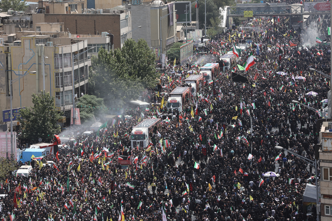 People attend the funeral procession of Iranian military commanders, nuclear scientists and others killed in Israeli strikes, in Tehran, Iran, Saturday. (West Asia News Agency-Reuters)