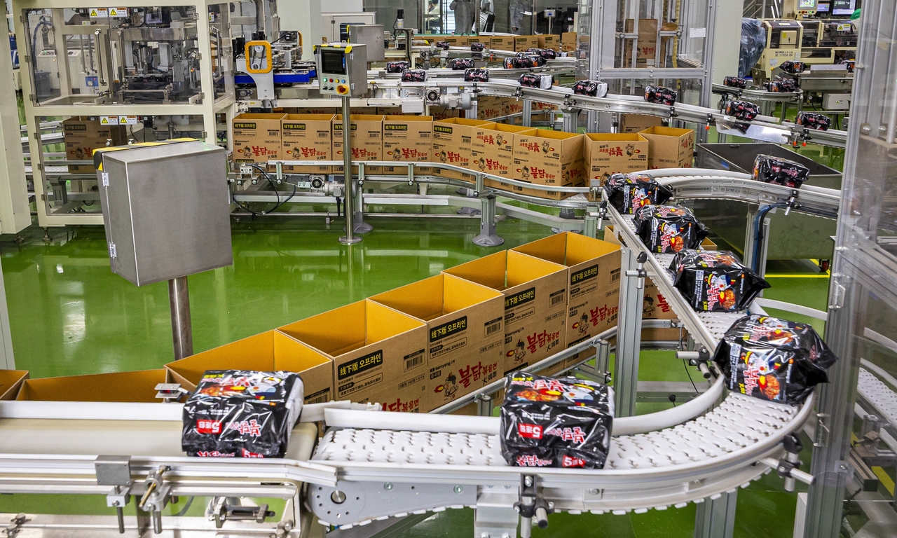 Packages of Buldak Ramen move along a conveyor belt before final boxing. (Samyang Foods)