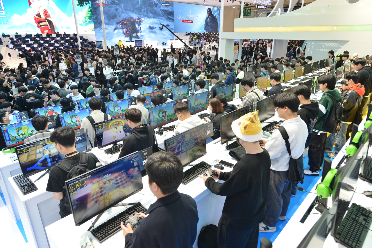 Visitors test out games at G-Star 2024 at Bexco in Busan in November 2024. (Busan Metropolitan City)