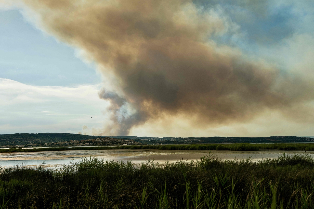 Smoke billows from a hillside in Bizanet, west of the city of Narbonne, southwest France, Sunday. (AFP-Yonhap)