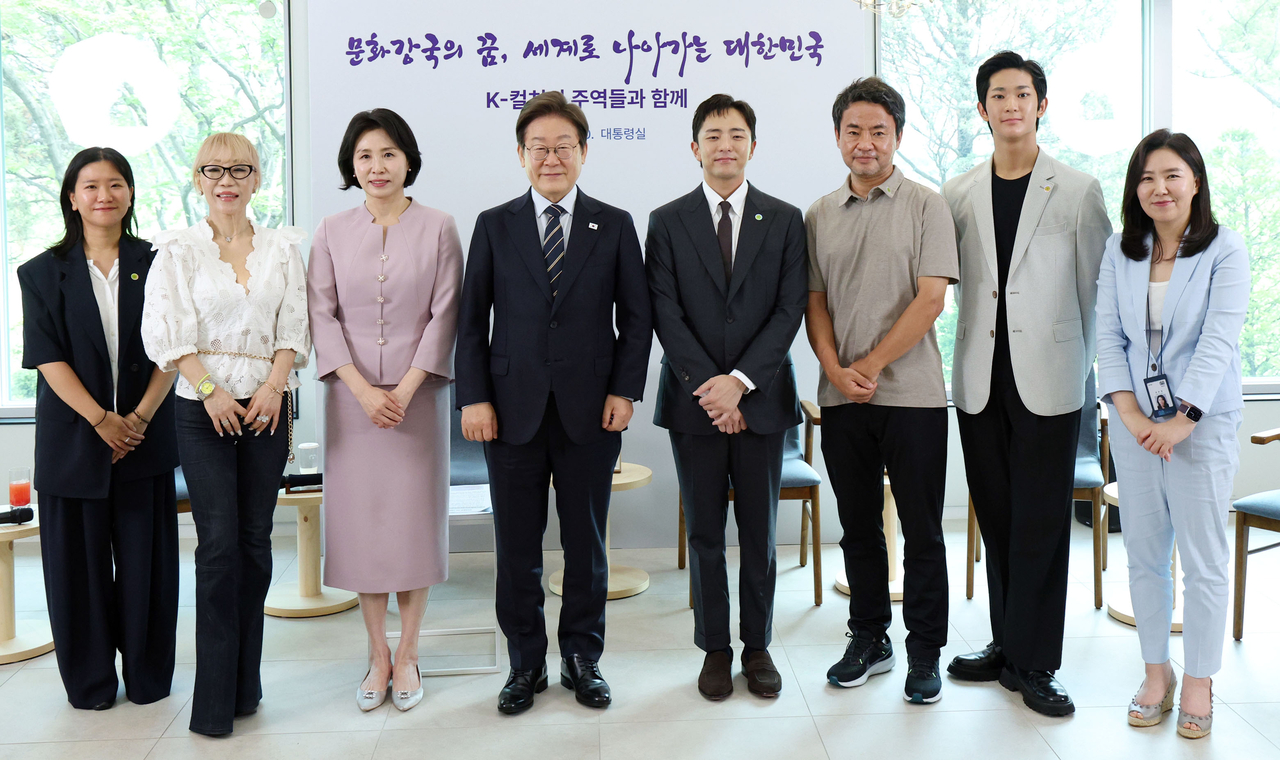 From left: film director Huh Ga-young, winner of first prize in the La Cinef section at the Cannes Film Festival; soprano Sumi Jo, recipient of the Commandeur of the Order of Arts and Letters from France; first lady Kim Hea Kyung; President Lee Jae Myung; playwright Park Chun-hue, whose musical "Maybe Happy Ending" swept six Tony Awards; director Kim Won-seok of the Netflix series "When Life Gives You Tangerines."; ballet dancer Park Youn-jae, winner of the Prix de Lausanne; and Presidential Office spokesperson Kang Yu-jung.