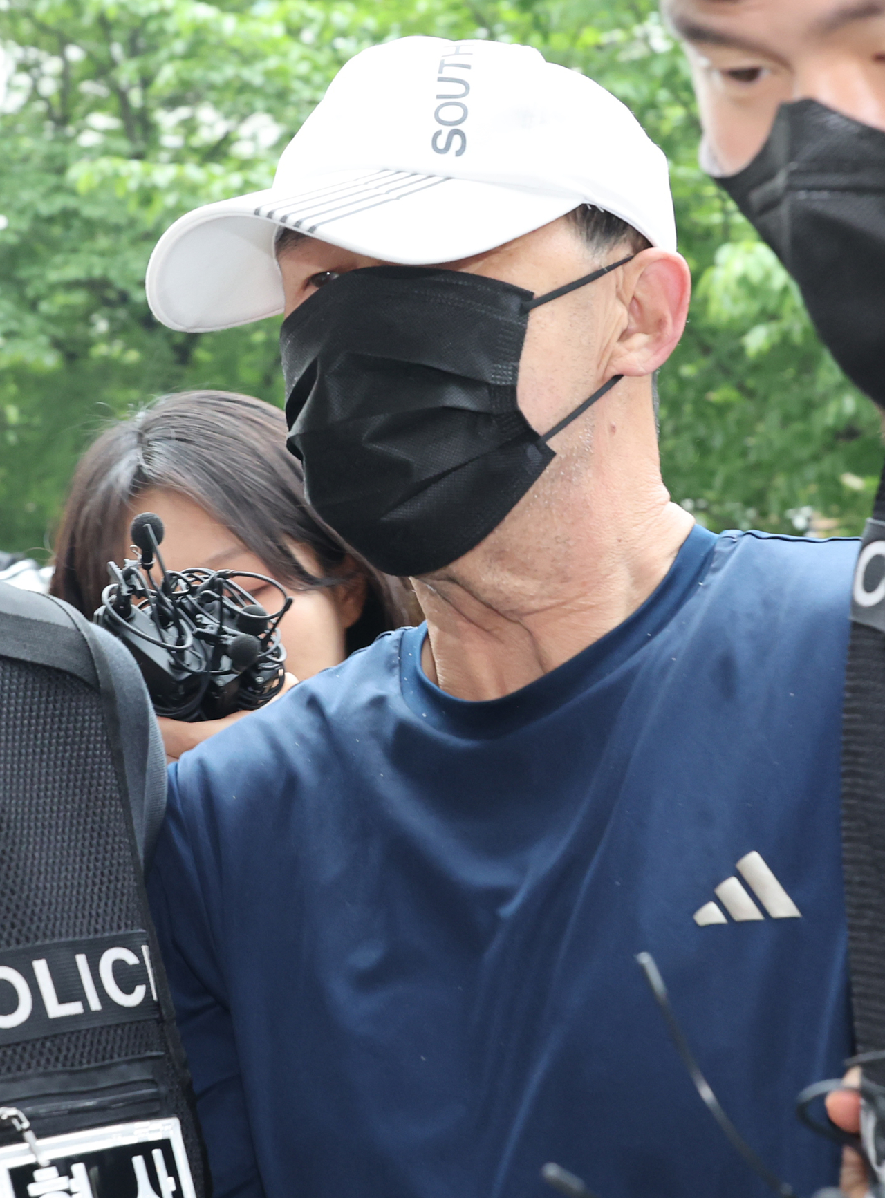 The suspected arsonist of a subway fire on May 31 is taken by police to attend a hearing for his arrest warrant at the Seoul Southern District Court on June 2. (Yonhap)