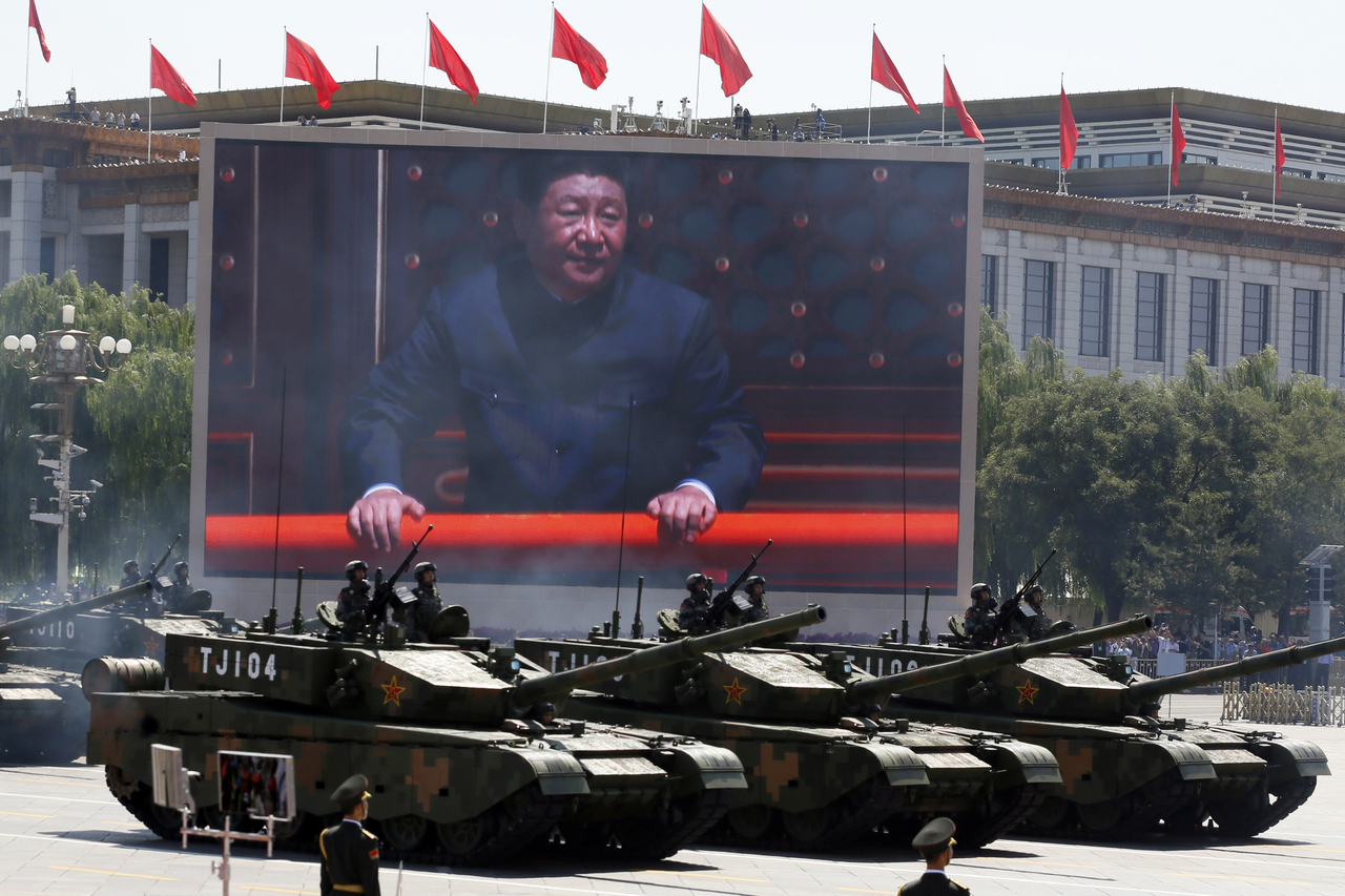 Chinese President Xi Jinping is displayed on an outdoor screen as Type 99A2 Chinese battle tanks take part in a parade commemorating the 70th anniversary of Japan's surrender in World War II, held in front of Tiananmen Gate in Beijing on Sept. 3, 2015. (AP)