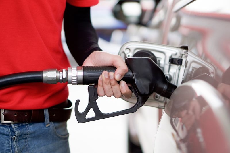 A driver fills up at a gas station. (Getty Images Bank)