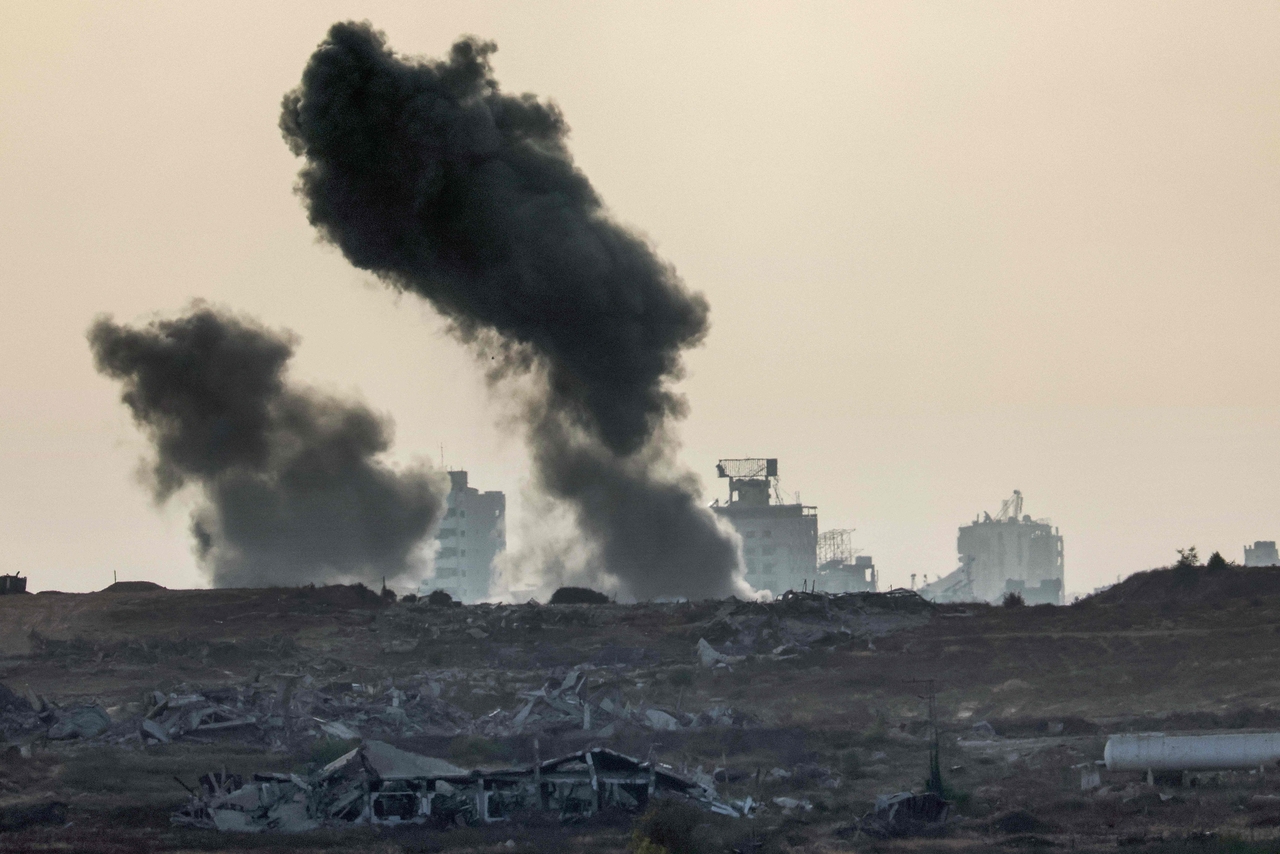 Smoke billows during an Israeli strike on the besieged Palestinian territory, Tuesday. (AFP-Yonhap)