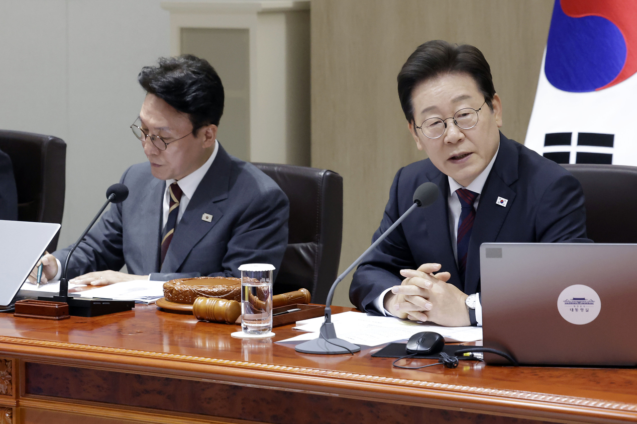 President Lee Jae Myung (right) speaks during a Cabinet meeting at the presidential office in Seoul on July 5, 2025. (Yonhap)