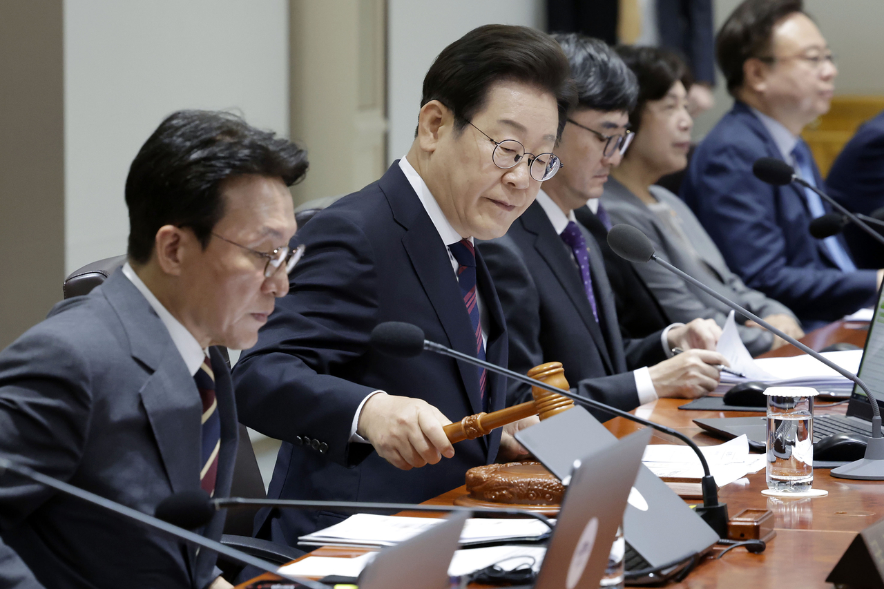 President Lee Jae Myung (second from left) presides over a Cabinet meeting at the presidential office in Seoul on July 5, 2025. (Yonhap)
