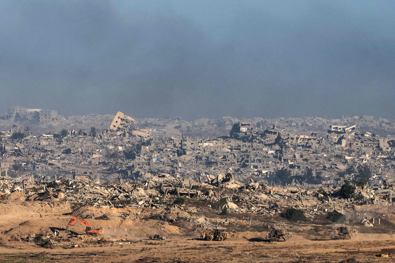 This picture, taken near Israel’s border with the Gaza Strip, shows Israeli bulldozers and vehicles inside the besieged territory on July 6. (AFP - Yonhap)