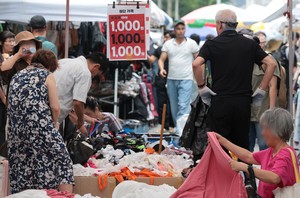 Budget shoppers crowd market