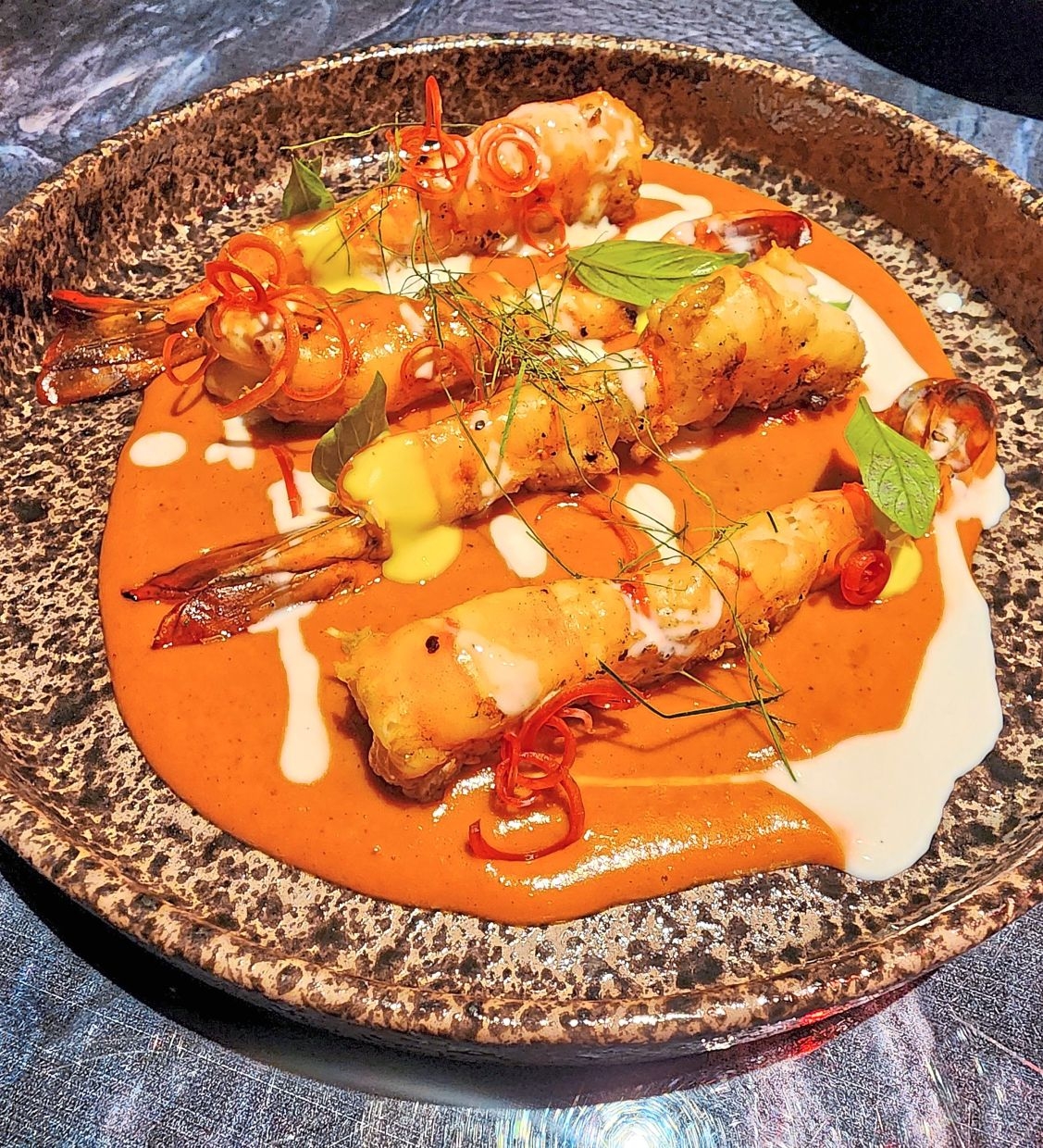 Chef "Ton" Thitid Tassana-kajohn's Panang curry with grilled prawns is a masterclass in rich, robust flavors.    (The Star)