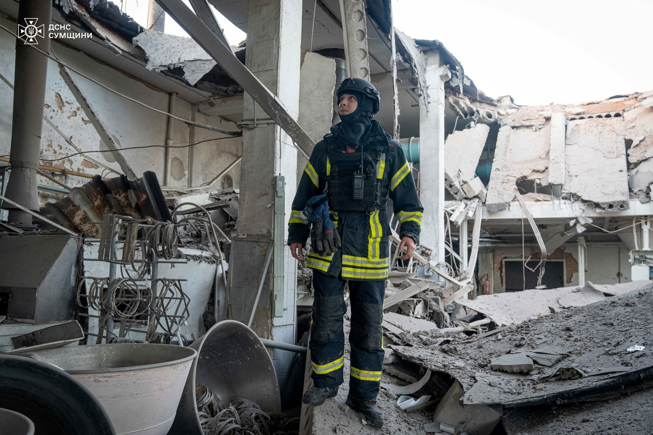 A rescuer inspects a compound of a bakery enterprise hit by a Russian drone strike in Sumy, Ukraine, April 18. (Reuters-Yonhap)