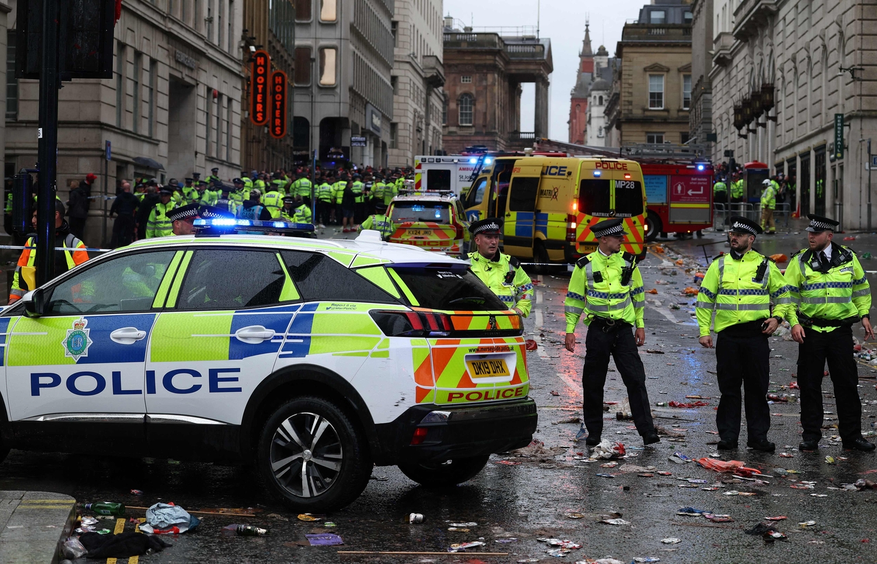 Police officers stand on duty at a cordon at the entrance to Water Steet in Liverpool, England, Monday. (AFP-Yonhap)
