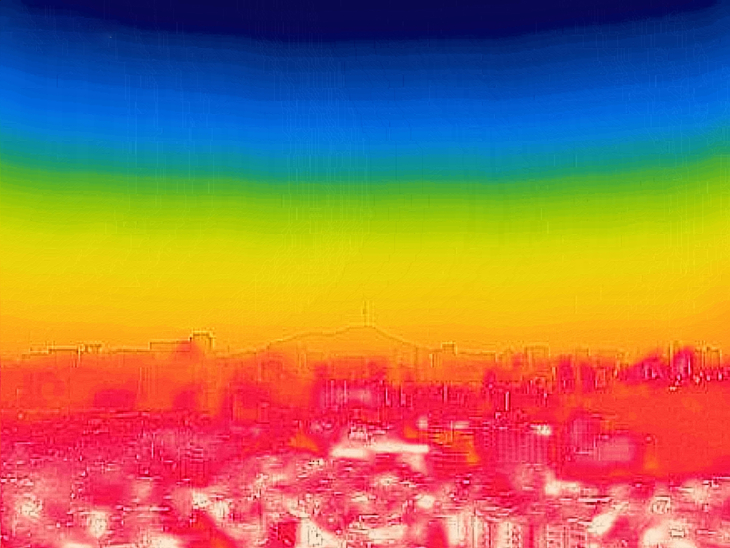 As a heat wave warning is in effect in Seoul, the cityscape around Mount Bugak in Jongno-gu, central Seoul, is seen in red through a thermal imaging camera due to the intense heat. In thermal images, the color red indicates high temperatures while blue indicates lower temperatures. (Im Se-jun/The Korea Herald)