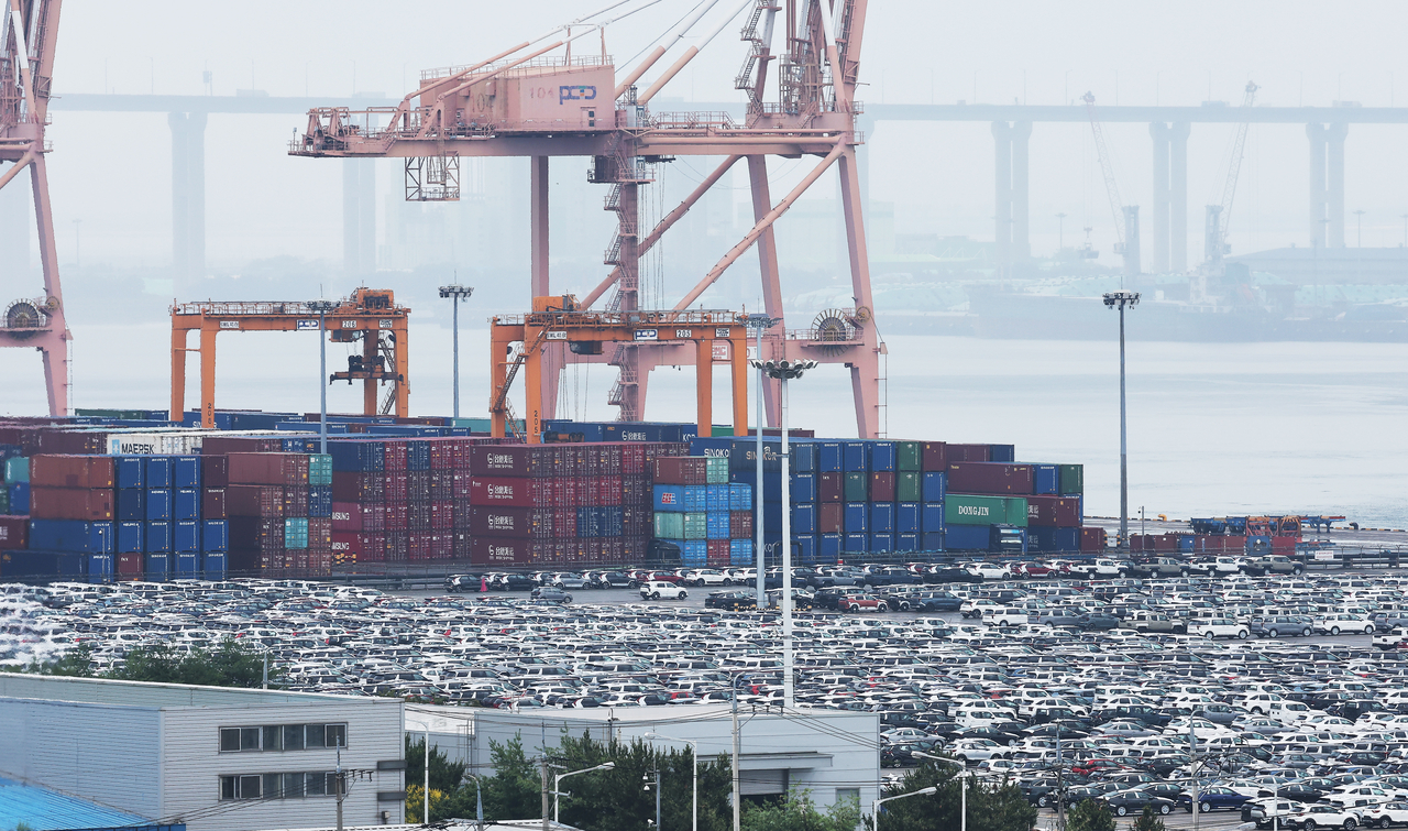 Containers and vehicles are stacked at a port in Pyeongtaek on July 1. (Yonhap)