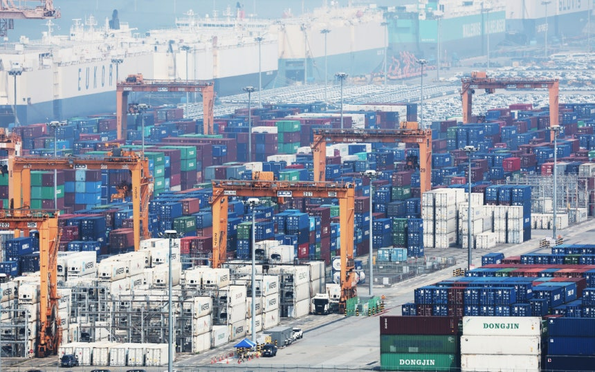 Containers are stacked for shipment at Pyeongtaek Port in Gyeonggi Province on Tuesday. (Yonhap)