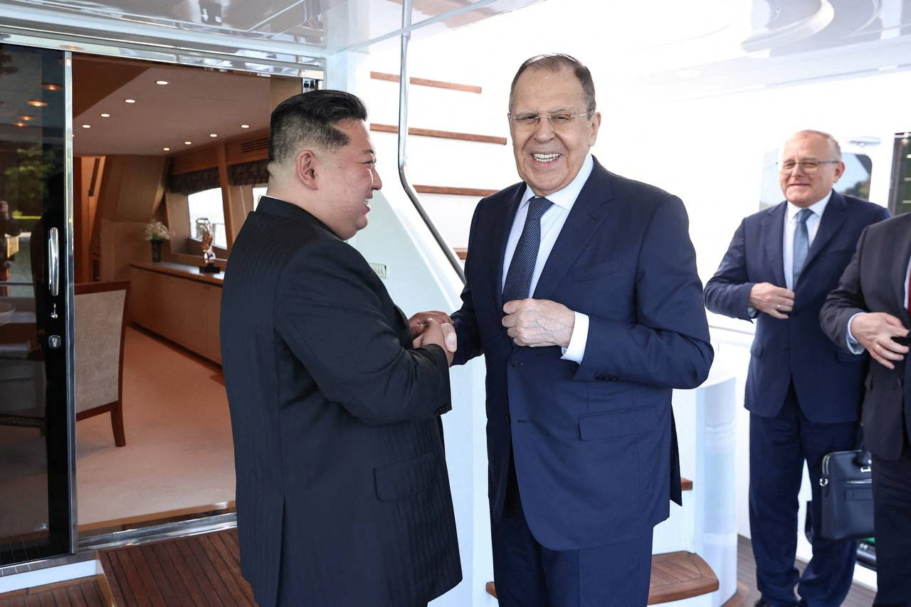 North Korean leader Kim Jong-un shakes hands with Russian Foreign Minister Sergei Lavrov during a meeting in Wonsan, North Korea, on Saturday.  (Russian Foreign Ministry via Reuters)