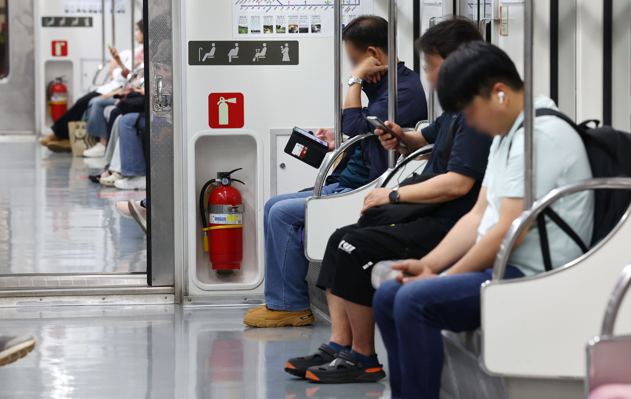 Passengers sit on a train on Seoul Subway Line No. 5 on June 3, 2025. (Yonhap)