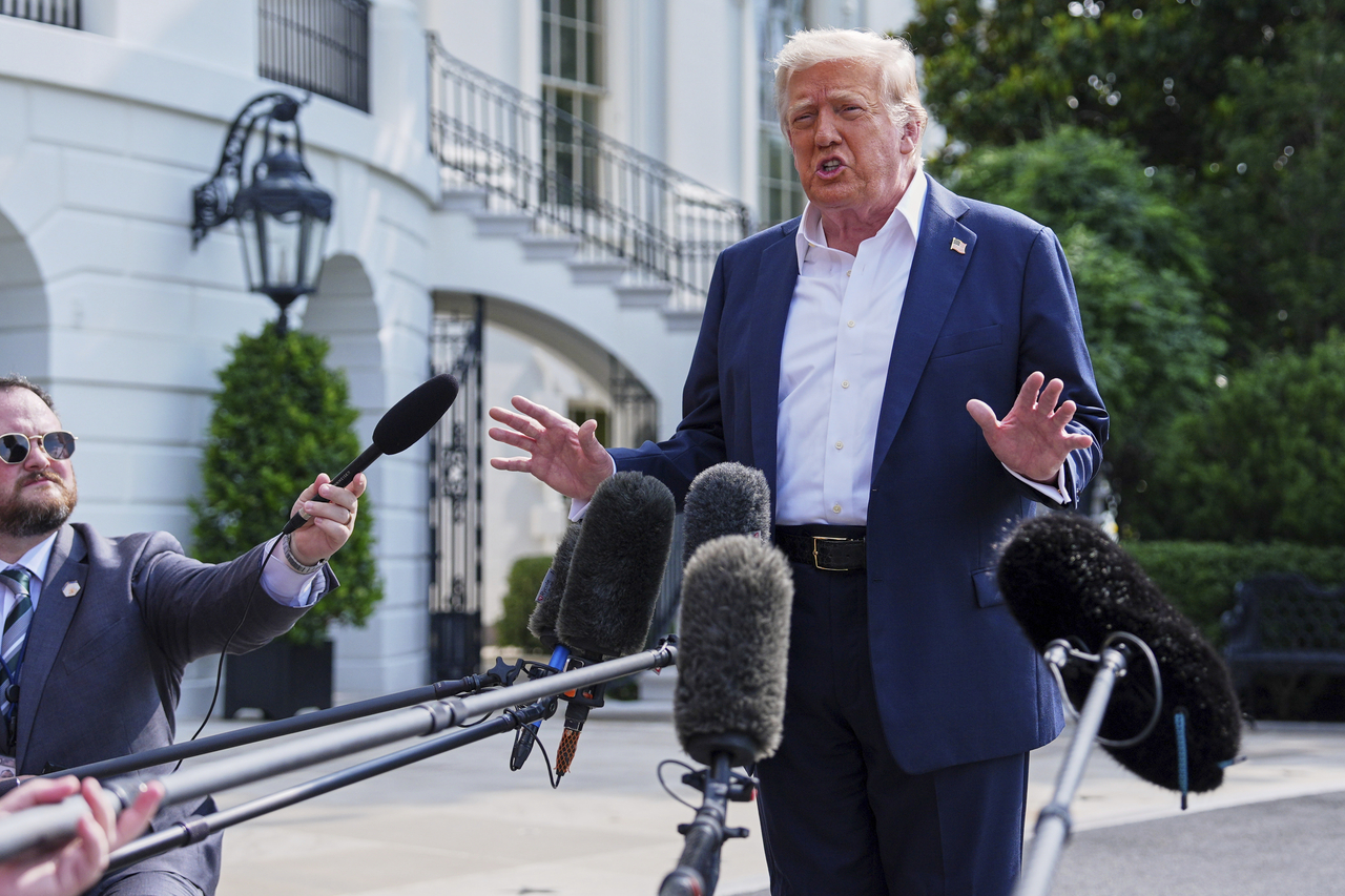 President Donald Trump speaks with reporters before departing the White House in Washington on Frinday.   AP-Yonhap