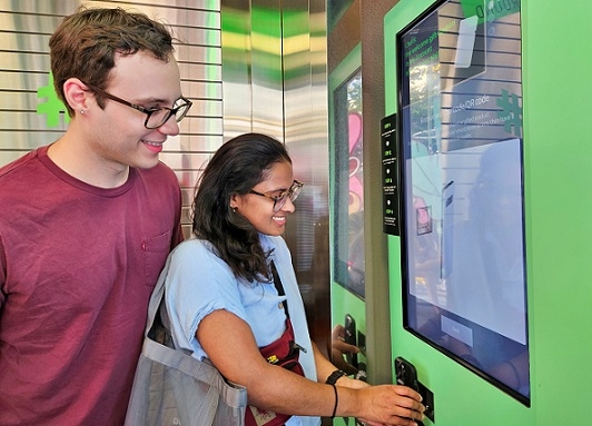 Customers sign up for Olive Young’s Global Mall using a registration kiosk at the company’s Myeong-dong store in Seoul. (CJ Olive Young)