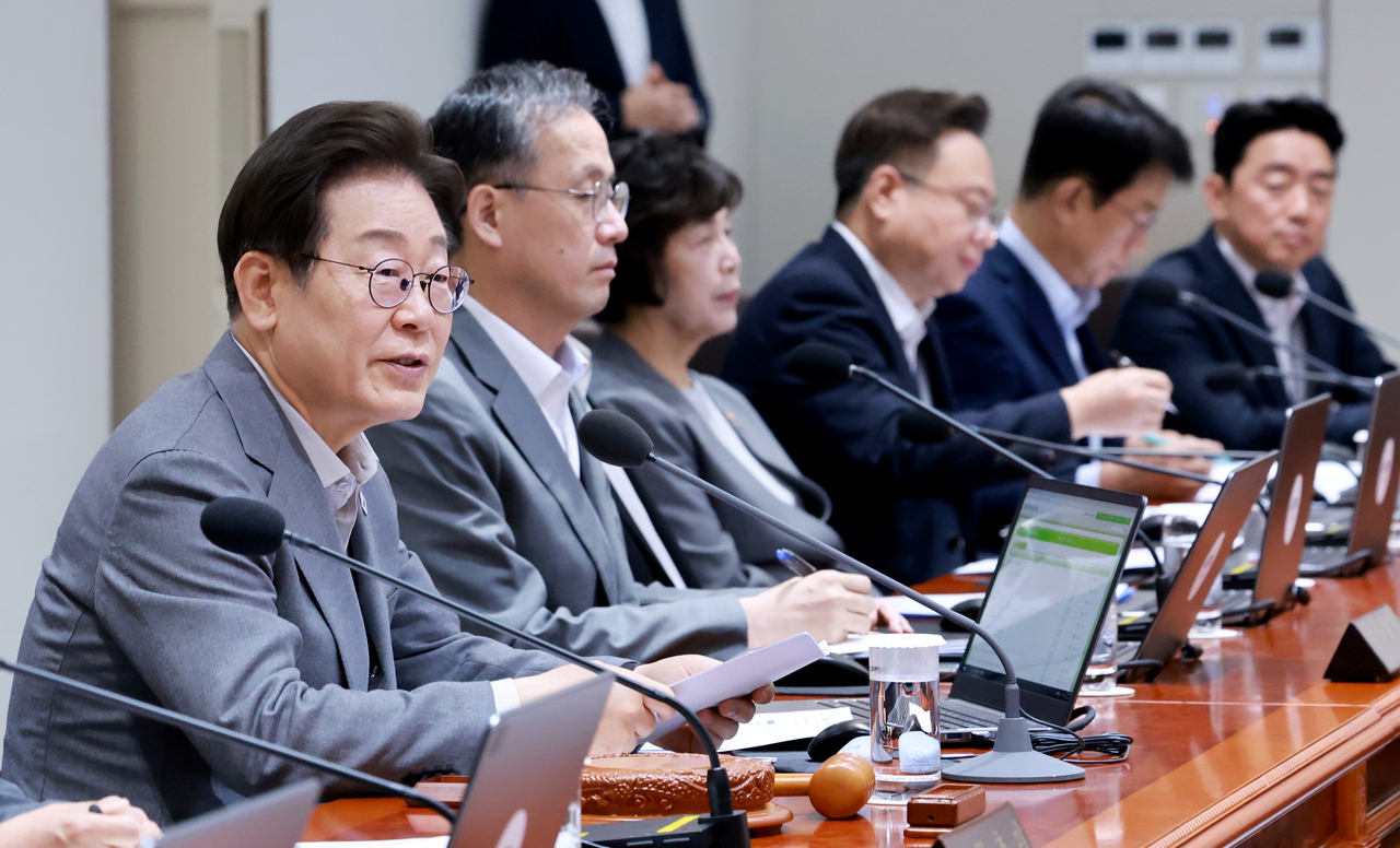 President Lee Jae Myung (2nd from left) presides over a Cabinet meeting at the presidential office in Seoul on Tuesday. (Yonhap)