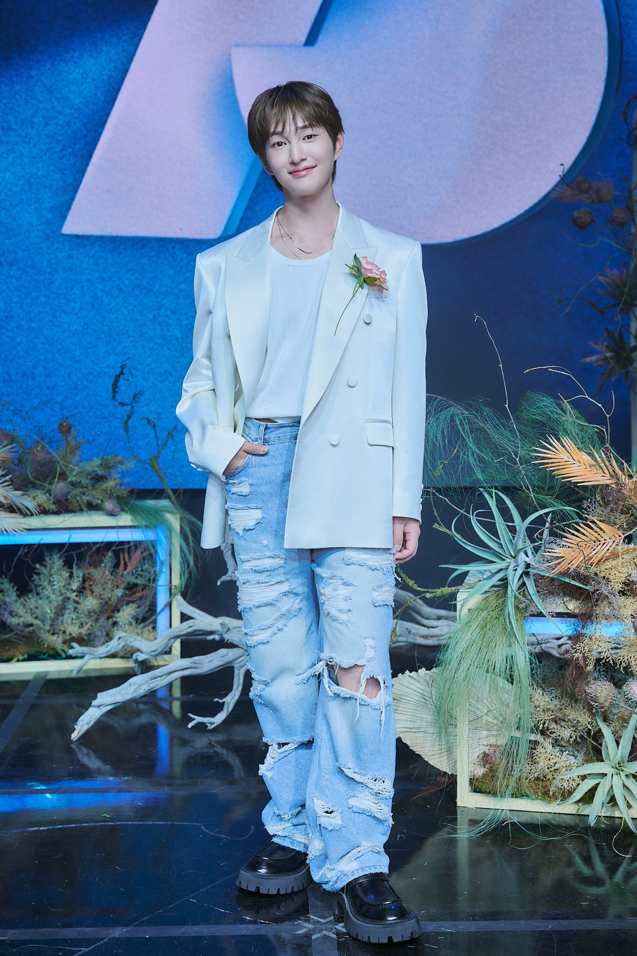 Onew poses for a photo at a press conference in Seoul, Tuesday. (Griffin Entertainment)