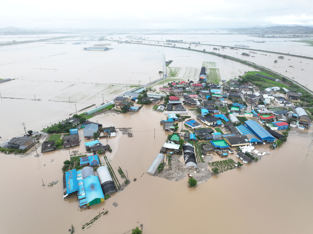 A village in Yesan, South Chungcheong Province, has been submerged due to heavy rainfall. (Yonhap)