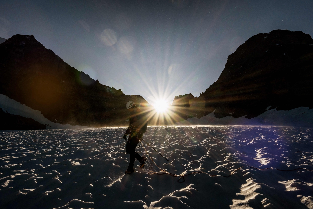 A mountaineer walks on the Glacier de la Selle in the Ecrins Massif in Saint-Christophe-en-Oisans, early in the morning on July 9. (AFP-Yonhap)