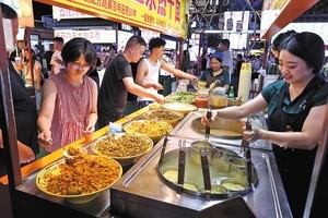 With 'smoke, fire and steam,' China's night markets erupt into life