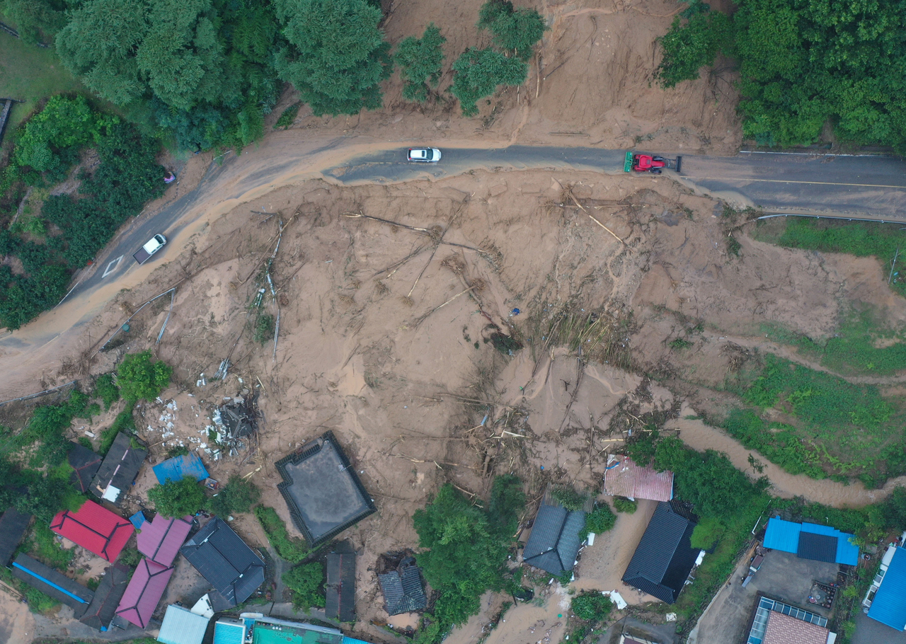A village, devastated by a landslide caused by heavy rains, in the southern county of Sancheong is seen on Saturday. (Yonhap)