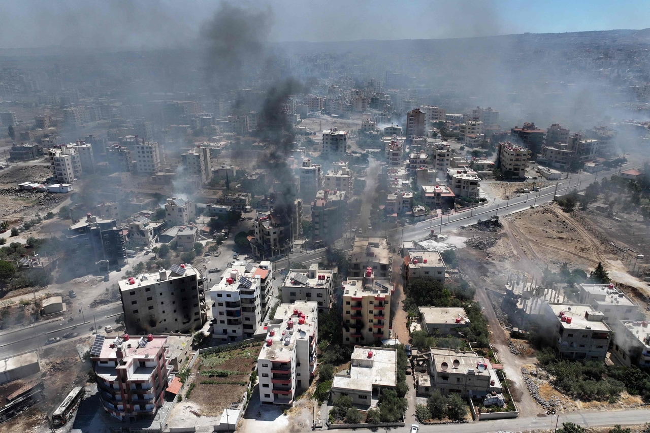 This aerial view shows smoke rising in the city of Sweida in southern Syria's Druze majority province on Saturday.  AFP-Yonhap
