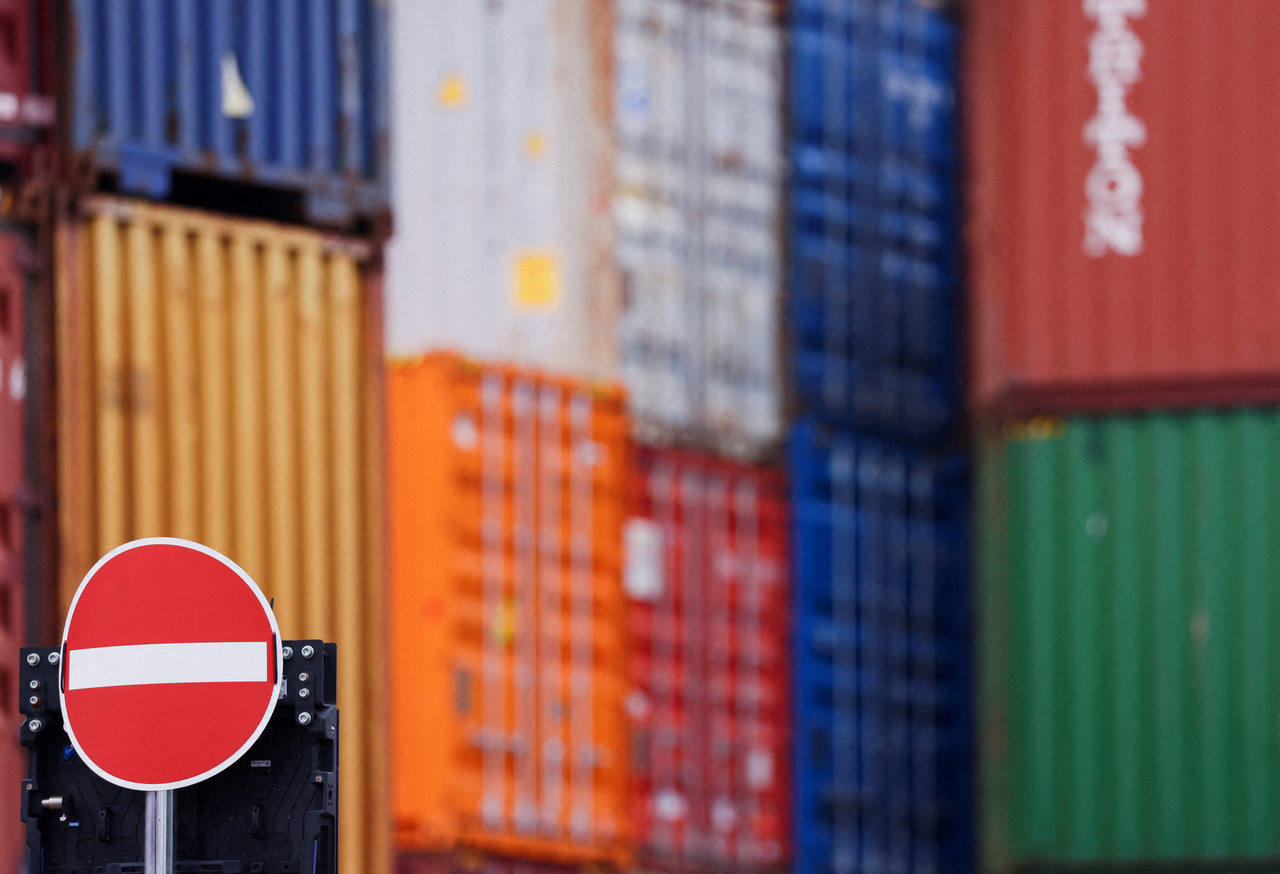 Containers are stacked behind a no entry sign in the harbor of Duisburg, Germany, July 14.   Reuters-Yonhap