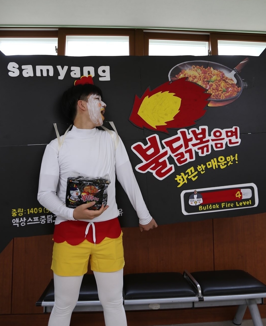 A student wearing a costume that looks like a Buldak Ramen package (Instagram)