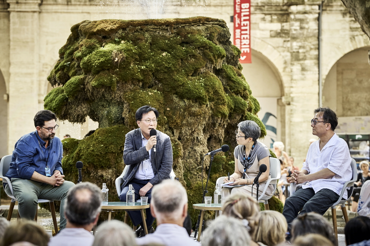 Avignon Festival Artistic Director Tiago Rodrigues (left) and Korea Arts Management Service President Kim Jang-ho (second from left) are seen at the Avignon Festival in France earlier in July. (KAMS)