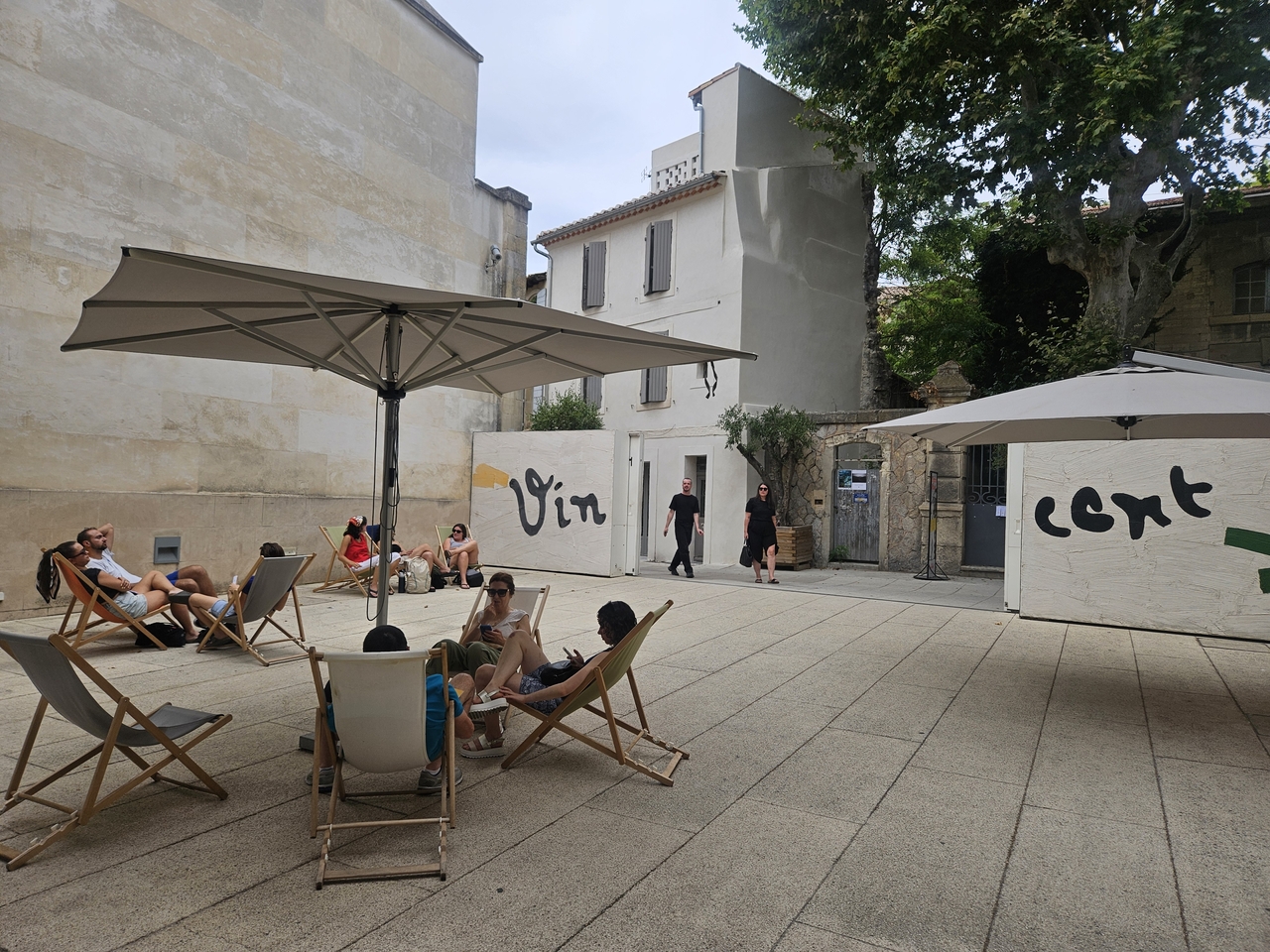 People relax outside the entrance to the Foundation Vincent Van Gogh Arles on July 6. (Park Yuna/The Korea Herald)