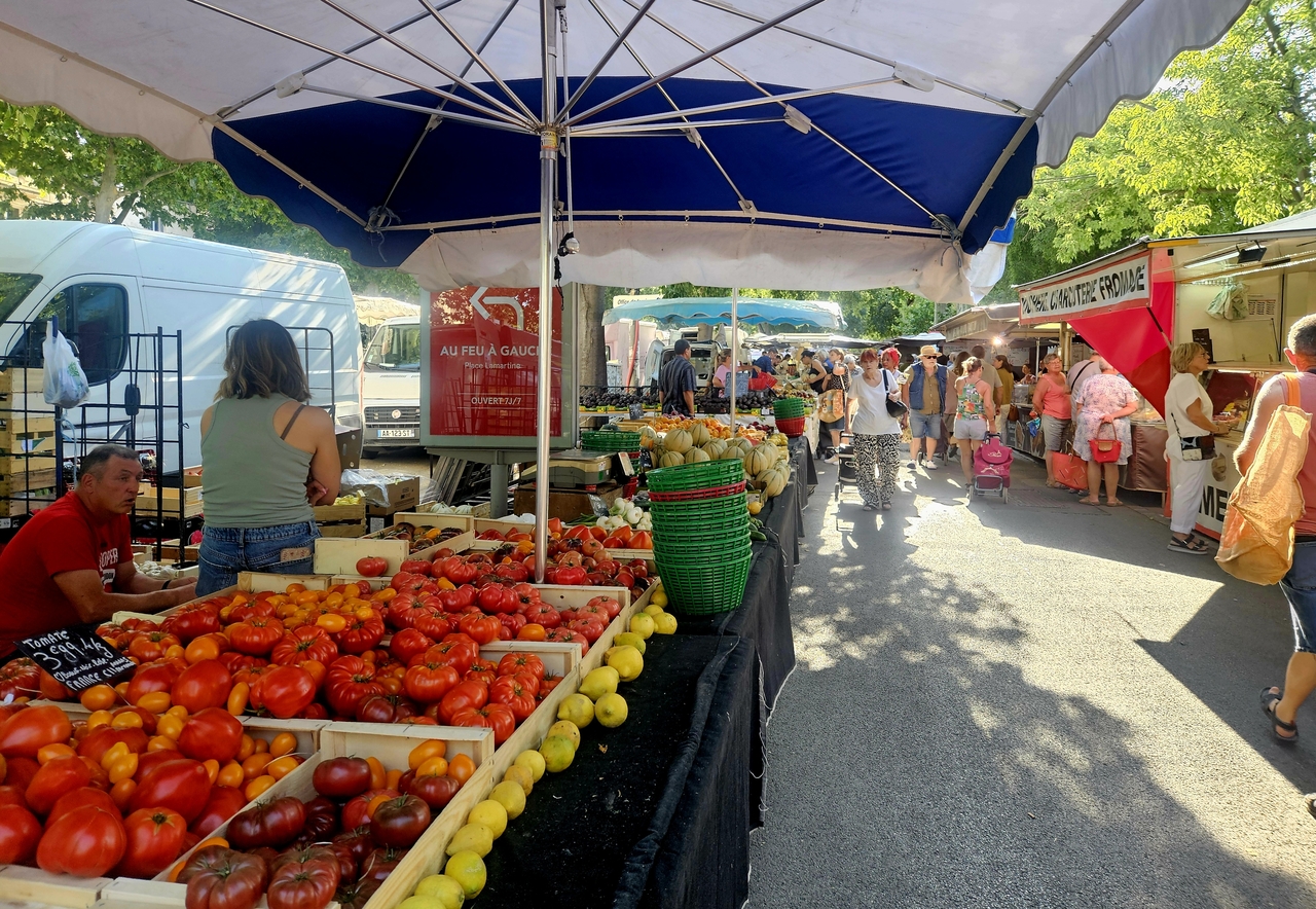 Local vendors sell produce at a market in Arles, France, on July 5. (Park Yuna/The Korea Herald)