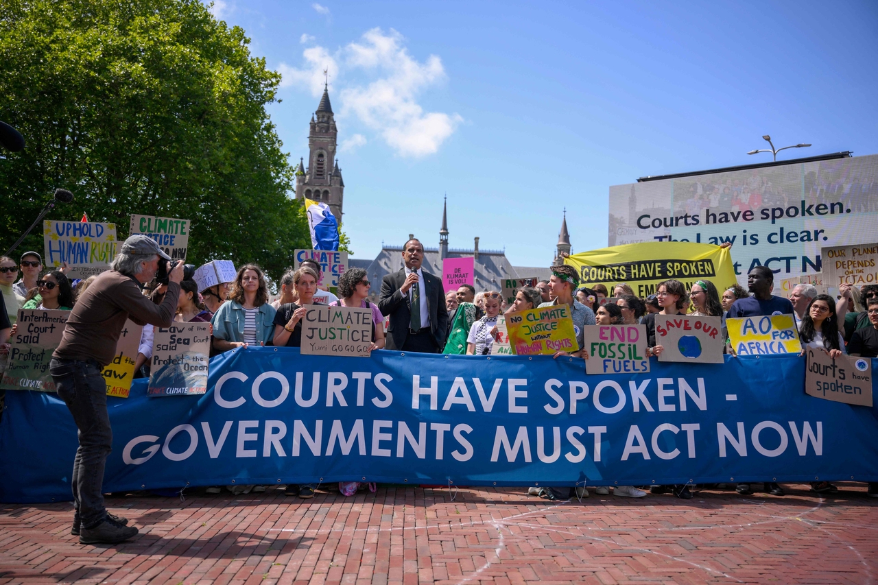 Vanuatu's Climate Change Minister Ralph Regenvanu (center) delivers a speech as he attends a demonstration ahead of the International Court of Justice session tasked with issuing the first Advisory Opinion on States' legal obligations to address climate change in The Hague on Wednesday.   AFP-Yonhap