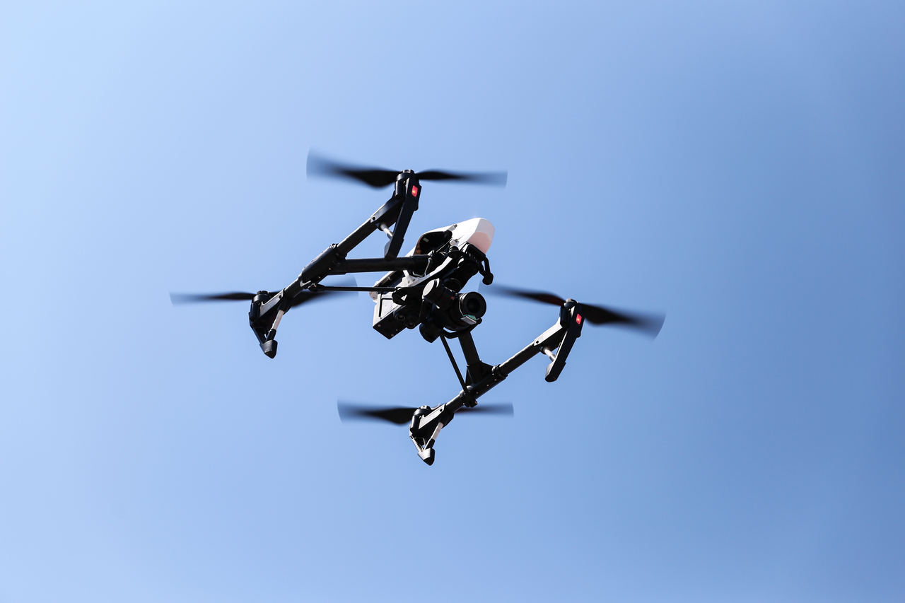 Black quadcopter helicopter is flying in sky. This photo is not related to the story. (123rf)