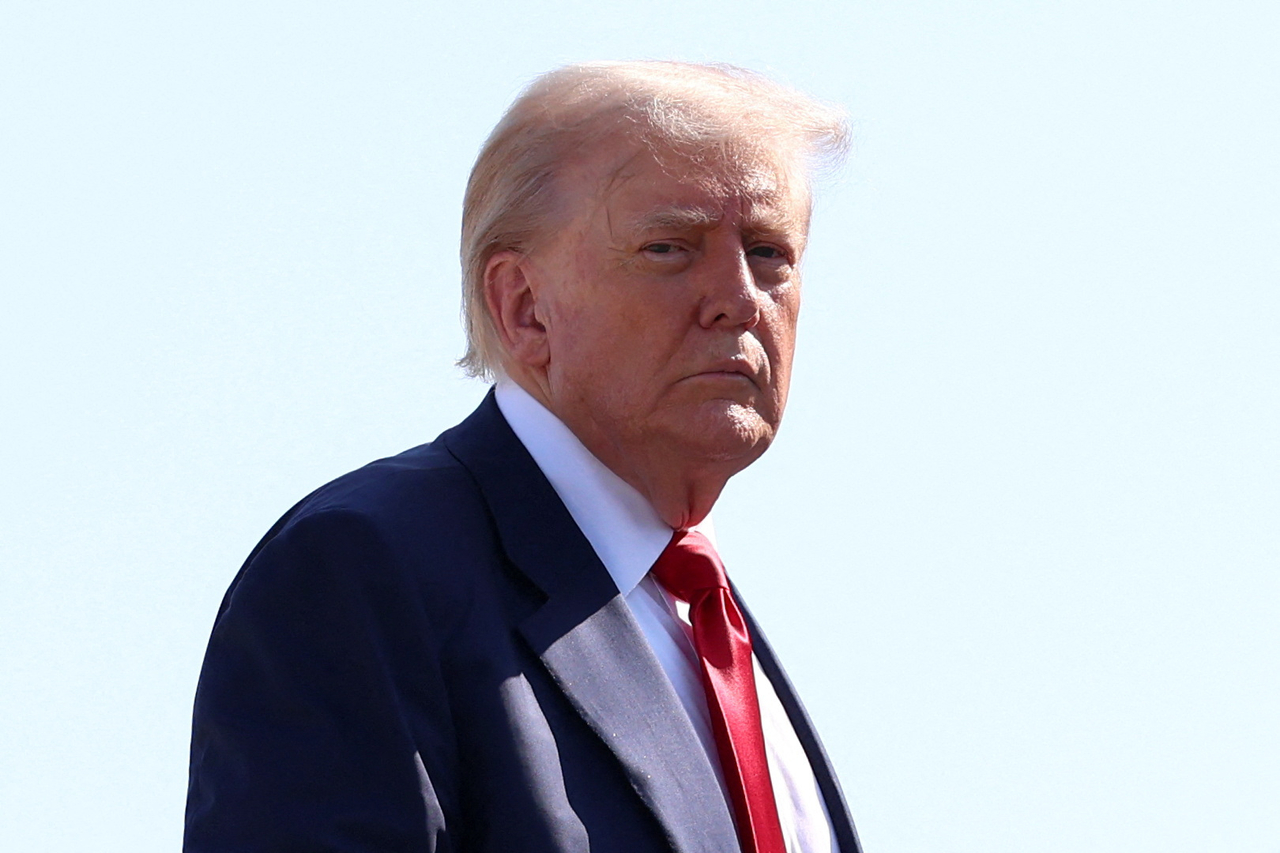 US President Donald Trump boards Air Force One, as he departs for Scotland, at Joint Base Andrews, Maryland, US, Friday. (Reuters-Yonhap)