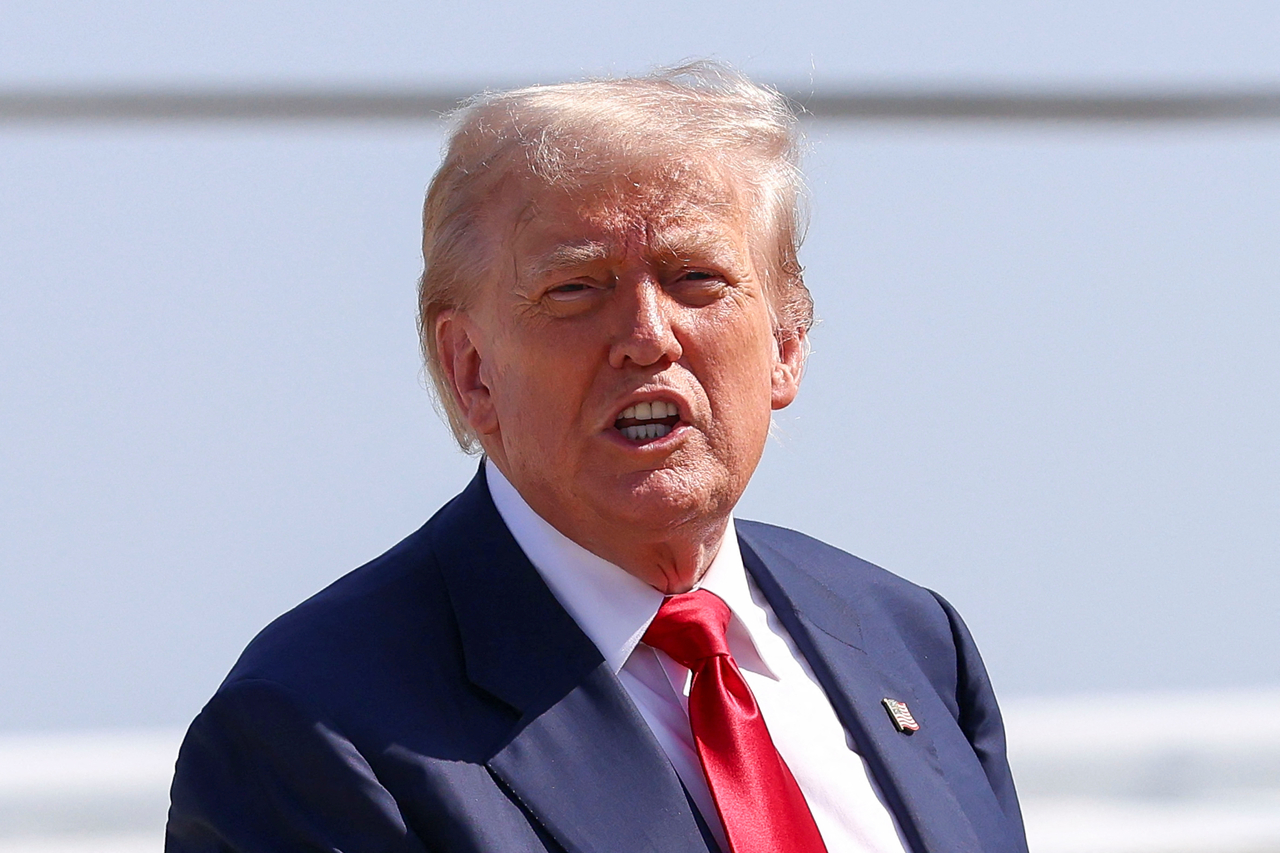 US President Donald Trump speaks after disembarking Marine One, as he departs for Scotland, at Joint Base Andrews, Maryland on Friday. (Reuters-Yonhap)