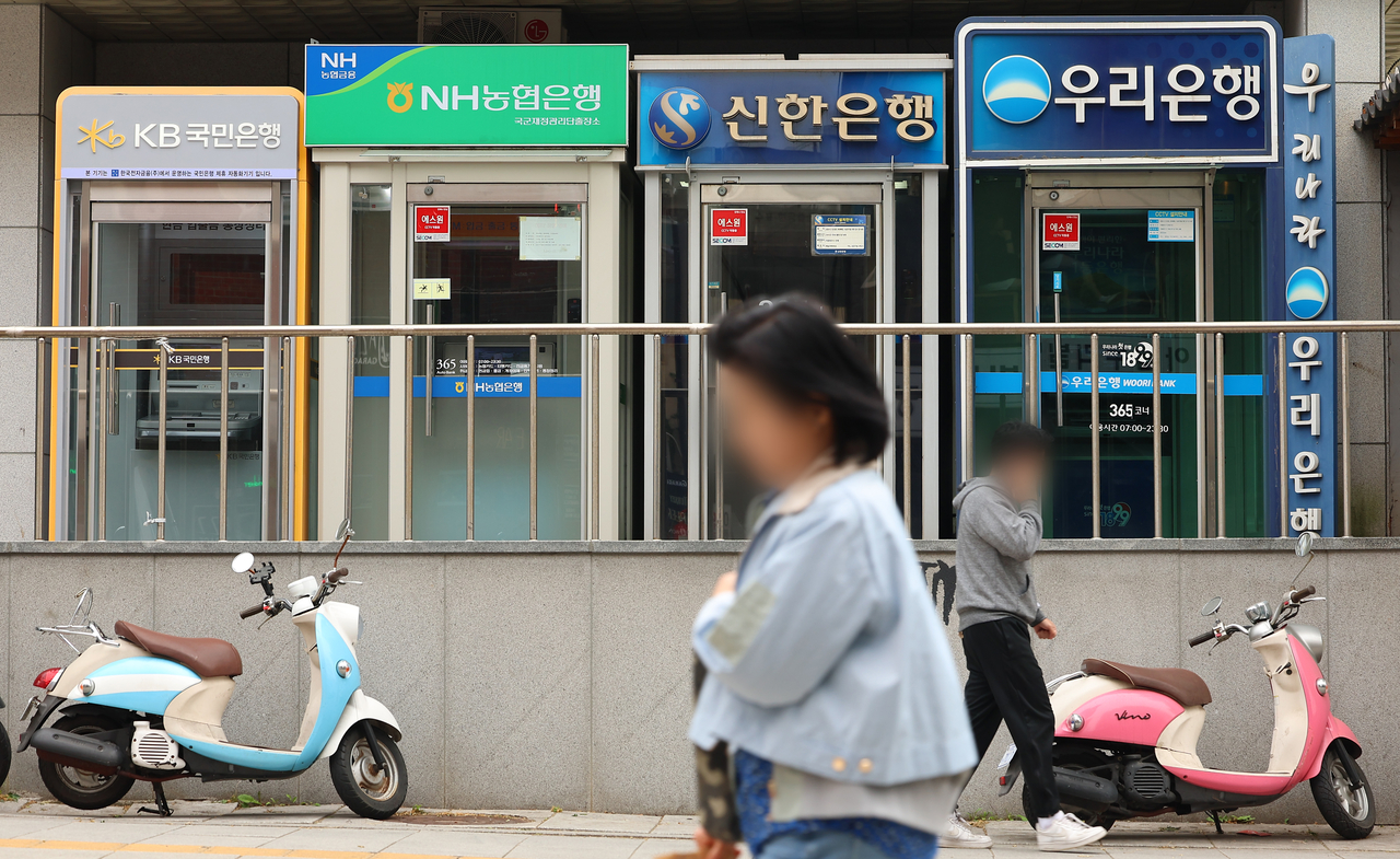 This file photo taken on May 5, 2025, shows automatic teller machines in Seoul. (Yonhap)