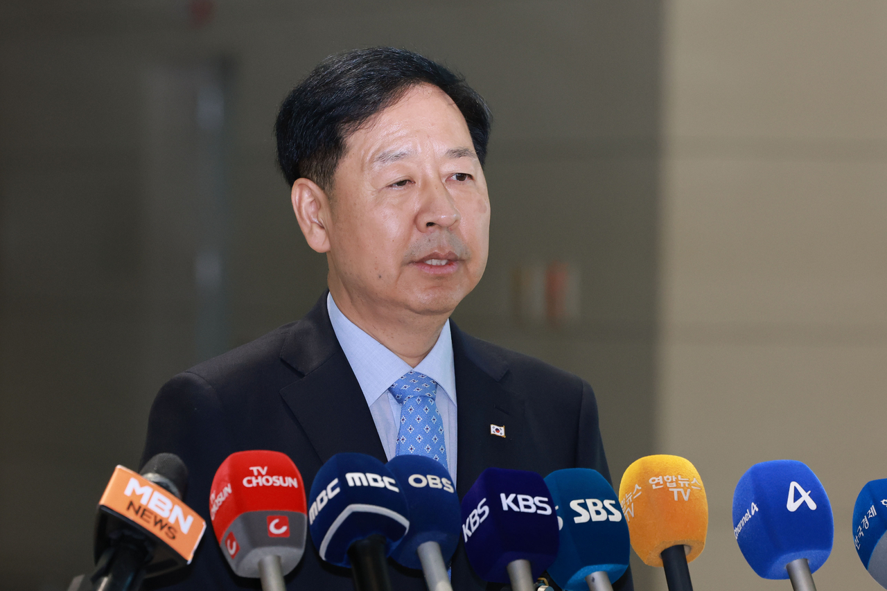 Finance Minister Koo Yun-cheol talks to reporters at Incheon International Airport, west of Seoul, on Tuesday. (Yonhap)