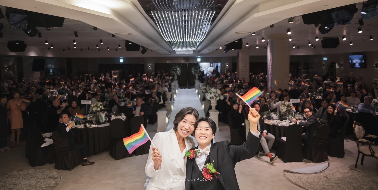 Lesbian couple Gwak I-kyung and Kim Hana celebrate their wedding ceremony, which Han helped organize, on Jan. 13, 2024. (Instagram @dan_photograph_)