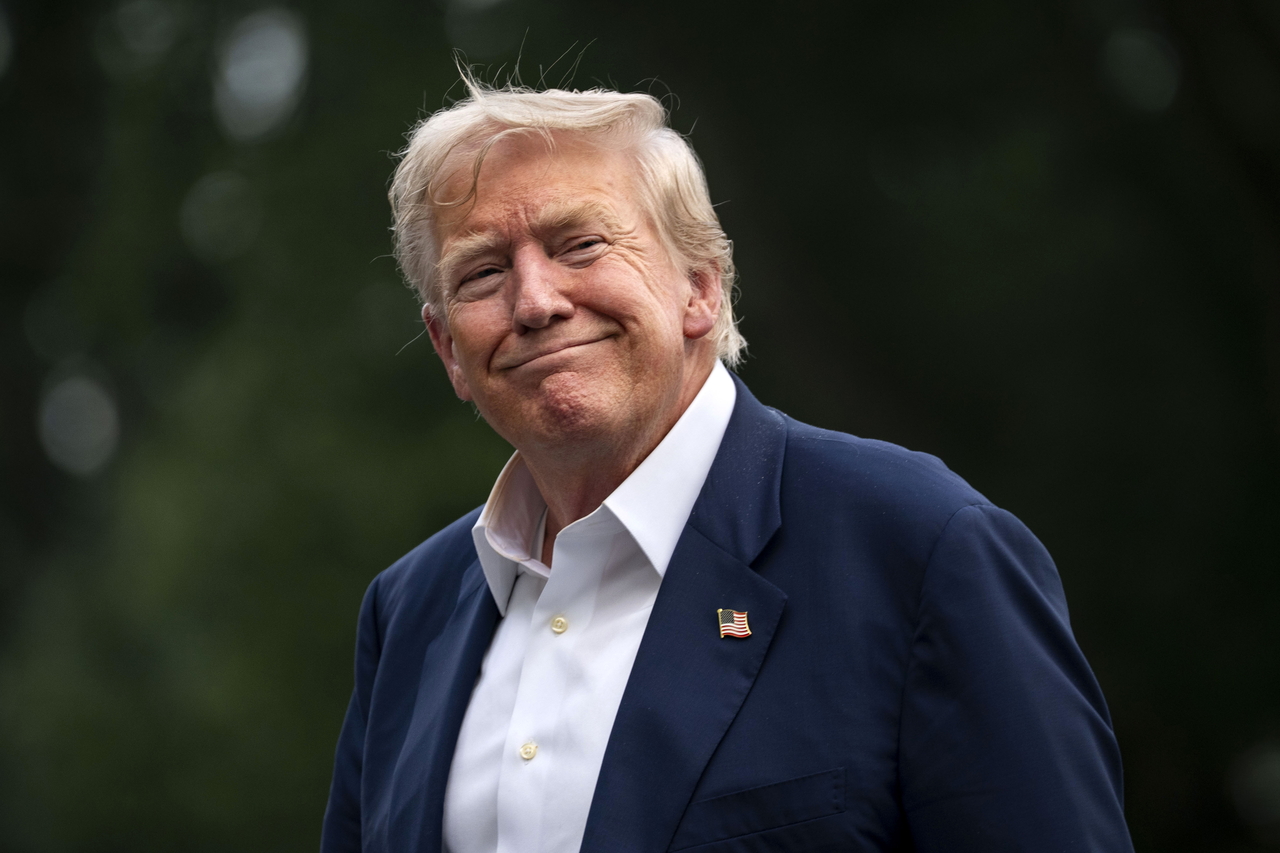 US President Donald Trump smiles after exiting Marine One on the South Lawn of the White House in Washington, on Tuesday. (EPA-Yonhap)