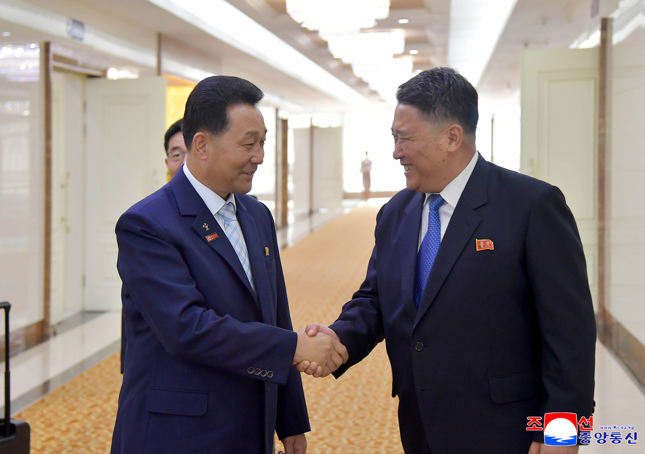 This photo shows Pak In-chol (left), chairman of North Korea's Supreme People's Assembly, leaving Pyongyang on Tuesday, to attend the World Conference of Speakers of Parliament in Geneva, Switzerland. (Yonhap)