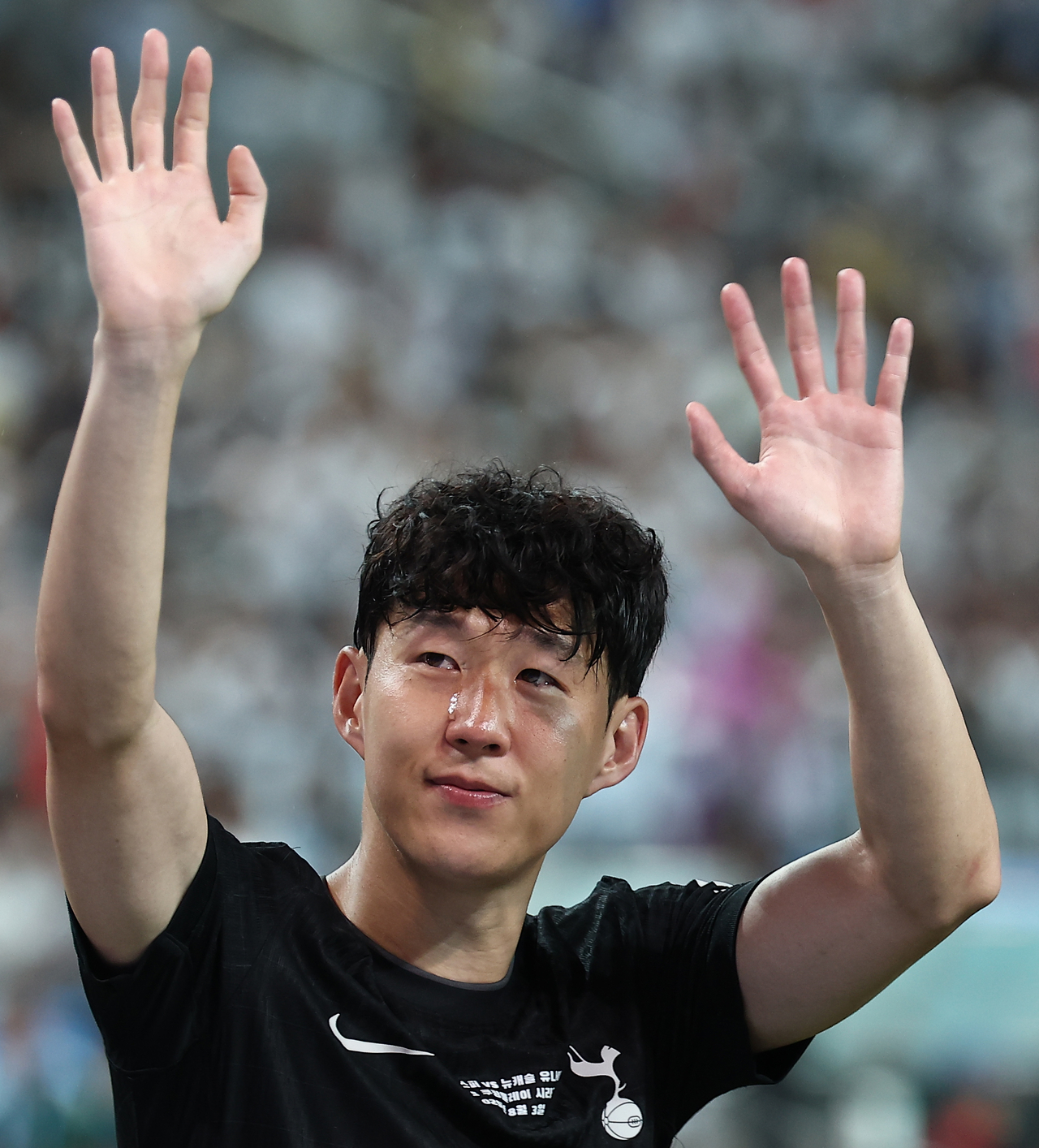 Son Heung-min, who has announced his departure from Tottenham Hotspur, tearfully waves to fans after a friendly match against Newcastle United held at Seoul World Cup Stadium on Sunday in Seoul, as part of the 2025 Coupang Play Series. (Yonhap)