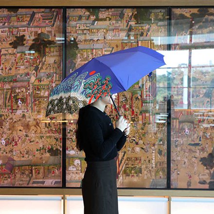 A sun umbrella featuring "Irworobongdo," a traditional Korean folding screen design that depicts the sun, moon and five mountain peaks, based on a 19th-century painting (National Museum of Korea)